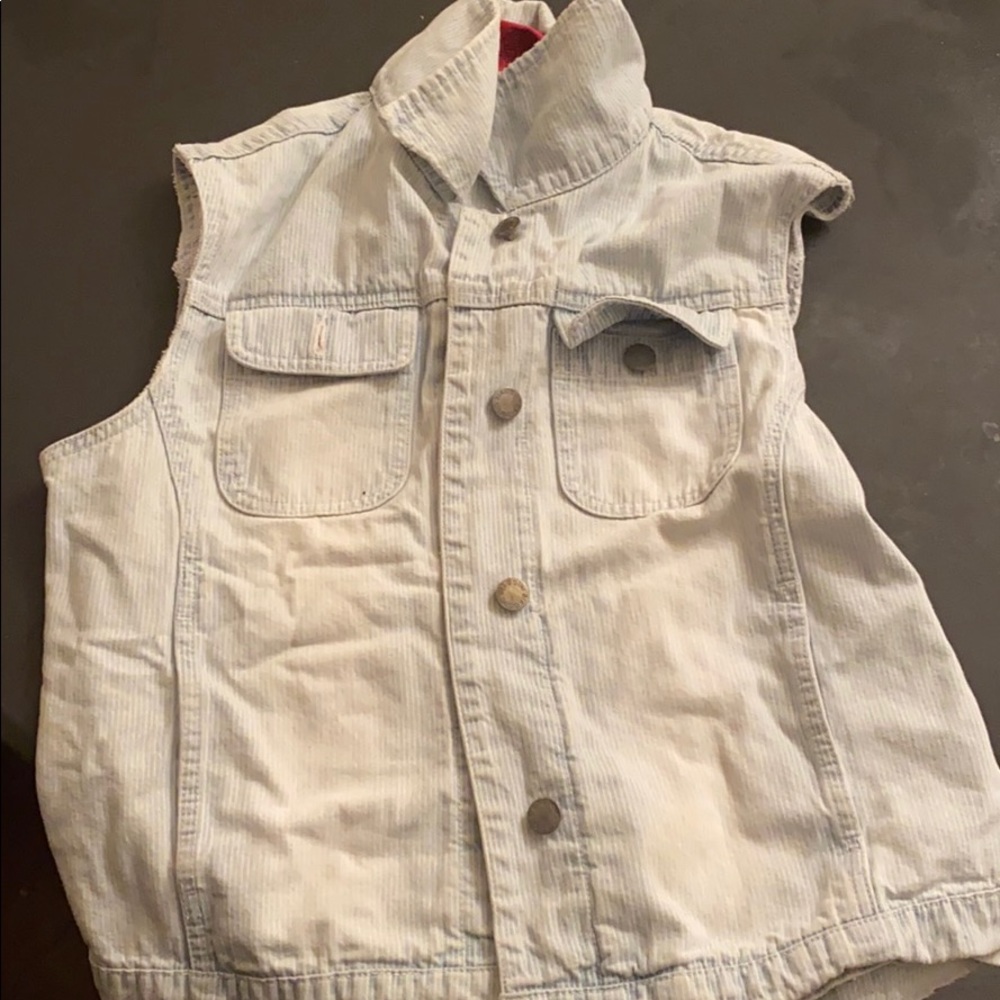 a light blue vest